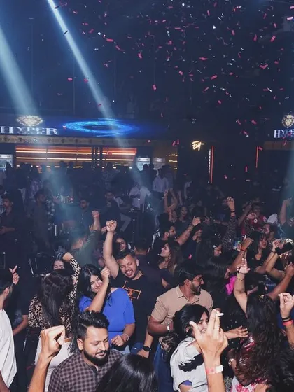 Confetti falls on the energetic crowd at Hyper Club, Raipur. Every night is a celebration.