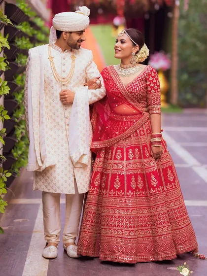 Walking together, the couple looks picture-perfect. The bride's makeup is designed to be radiant and long-lasting, ensuring she looks flawless throughout the celebrations.
