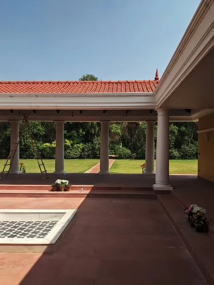 A view from the verandah of our upcoming farmhouse project. The use of classical columns and a terracotta tile roof creates a tranquil space that frames views of the surrounding greenery.