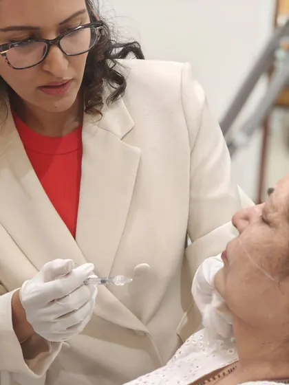 Demonstrating the precise injection technique for dermal fillers during my workshop. Teaching is a passion, and it's rewarding to pass on the skills I've honed over years of practice and global training.