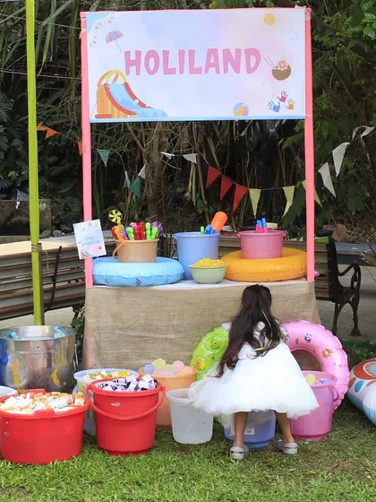 The 'Holiland' station at the kids' party, where little ones could pick up their game prizes like water guns and floats.