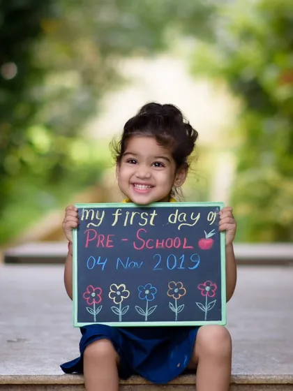 The first day of preschool is a huge milestone, full of excitement and big smiles. We took this photo outdoors to capture the feeling of a new adventure beginning. The little chalkboard sign adds a personal touch, turning a simple portrait into a cherished memory of a very special day.