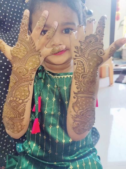 Look at this little cutie showing off her festive mehndi. I always use simpler, quicker designs for children that still look beautiful and make them feel special.