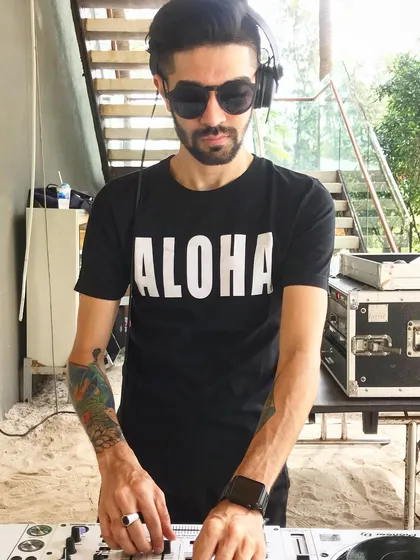 A closer look at my setup during a beach party. Even in a casual setting, I maintain my focus on the mix, blending tracks smoothly to provide a continuous soundtrack for the event.