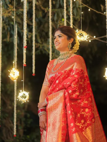 Another beautiful shot of the bride, her makeup looking radiant under the warm lights. This look is a memory in itself.