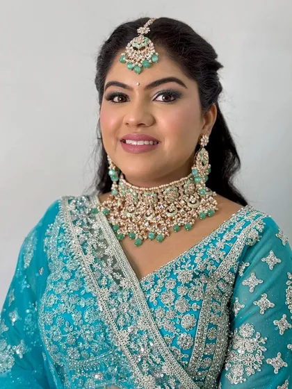 A close-up portrait showing the beautiful blend of the shimmery eyeshadow and the flawless base.