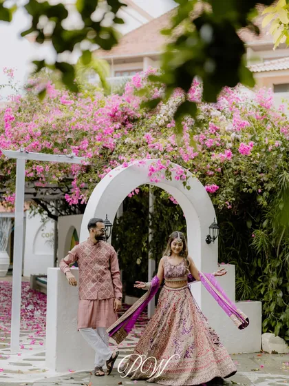 A beautiful couple portrait under a canopy of bougainvillea. We always look for natural photo opportunities within the venue to complement our decor.