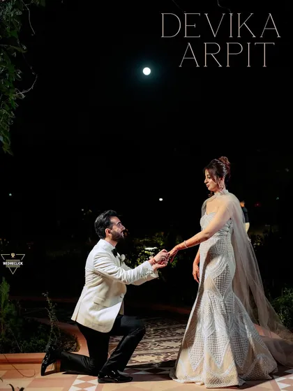 A proposal under the moonlight. For this shot, we created a truly cinematic and romantic scene. The dramatic lighting and elegant attire come together to create a powerful, emotional portrait that feels like a still from a classic film, perfect for a glamorous pre-wedding album.