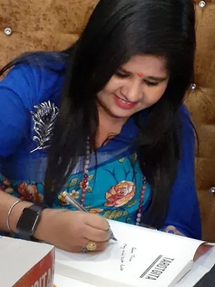 A candid shot of me signing a copy of TarotGita. I believe that when I sign a book, I'm passing on a small piece of the energy and intention that went into creating it.