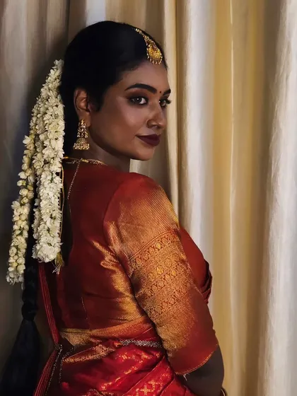 Another angle of this beautiful dusky bride. The side profile shows the flawless application of makeup and how it enhances her features without masking her skin.