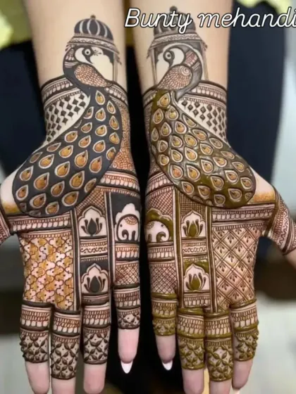 This design features bold and beautiful peacocks, a classic element of Rajasthani mehendi, crafted with sharp lines and detailed feather work that covers the back of the hands.