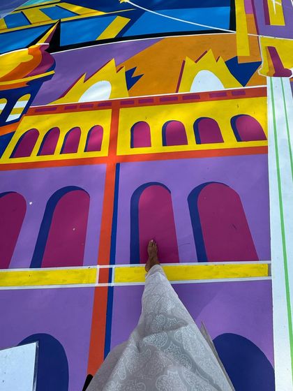 Walking on a canvas of my own making. This shot shows the intricate details and bold colours of the architectural elements I designed for the NBA 2K court mural, inspired by the city of Mumbai.