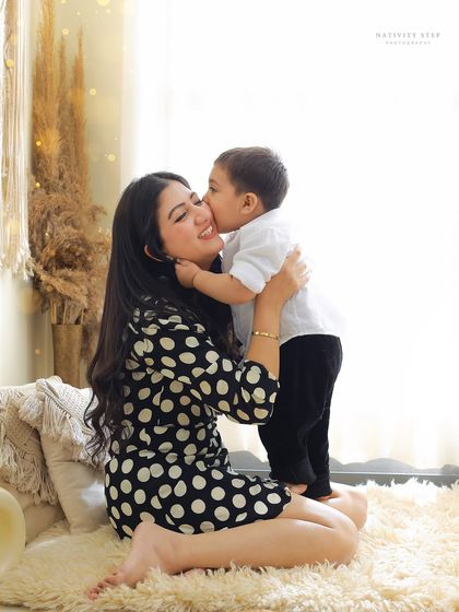 A sweet kiss from a son to his mom. We focus on capturing these small, tender interactions that mean so much during our mother and child photoshoots.