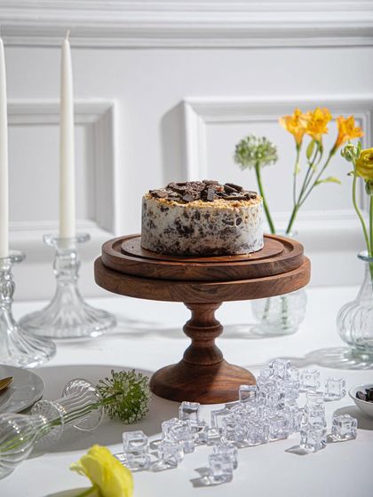 Our Cookies and Cream ice cream cake, a crowd favourite, ready for a celebration with its festive and elegant presentation.