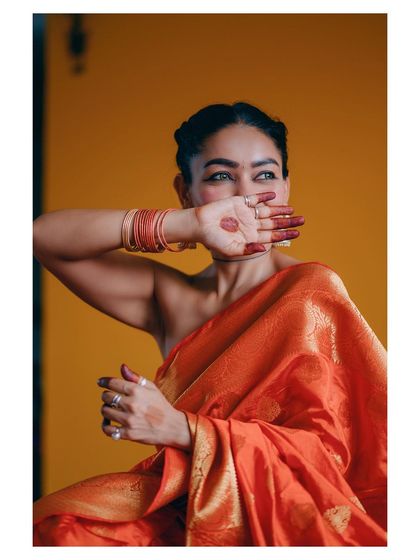 A more artistic and expressive portrait, where the subject's pose and glance create a sense of mystery and grace.