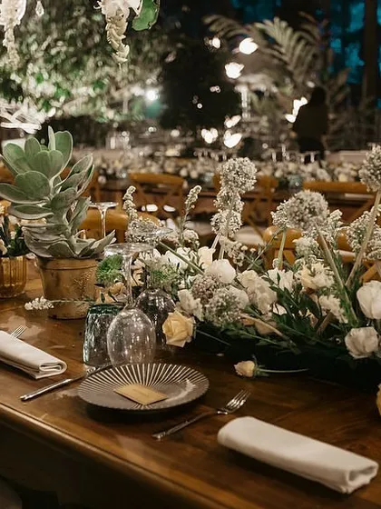 This was a seven-course wedding dinner we orchestrated deep in a Coorg forest with no mobile signal. Every detail, from the rustic wooden tables and lush floral runners to the perfectly timed service, was meticulously planned to create an unforgettable dining experience.