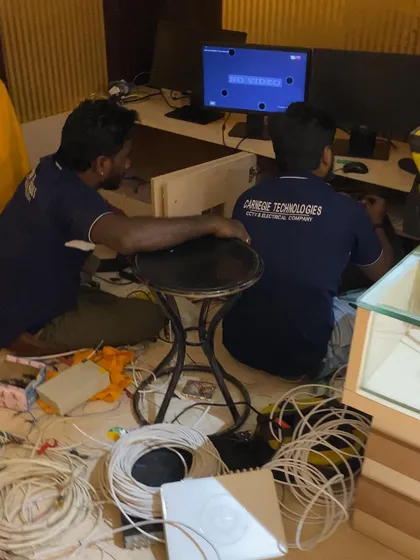 This is a typical scene during a complex network overhaul. Our technicians are skilled at navigating and organizing large volumes of wiring to diagnose issues and implement a structured cabling solution that eliminates clutter and improves network reliability.
