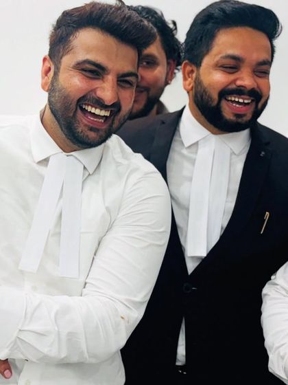 Sharing a light-hearted moment with a colleague. A positive team dynamic is essential for navigating the pressures of criminal and cybercrime law.