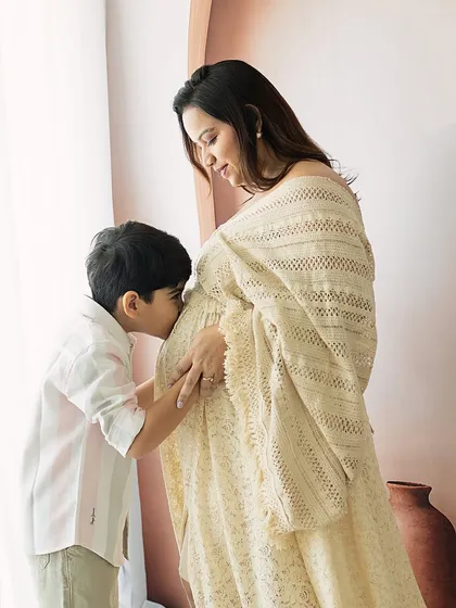 A moment of pure love and anticipation. An older brother gently kisses his mother's belly, already forming a bond with the sibling he is yet to meet. My maternity sessions focus on these unscripted, heartfelt interactions that tell the story of a growing family.