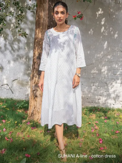 The Suhani A-line cotton dress from our summer appliqué collection. This piece combines hand-cut appliqué and hand-block printing, two crafts of Rajasthan, in one beautifully slow-made garment.