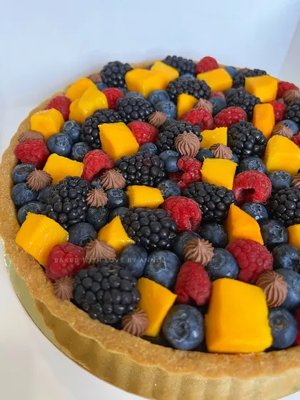 A tropical dream. My Signature Chocolate Pudding Tart is topped with fresh Alphonso mango chunks and a mix of summer berries. It’s a beautiful dessert that gives you tropical feels in every bite.