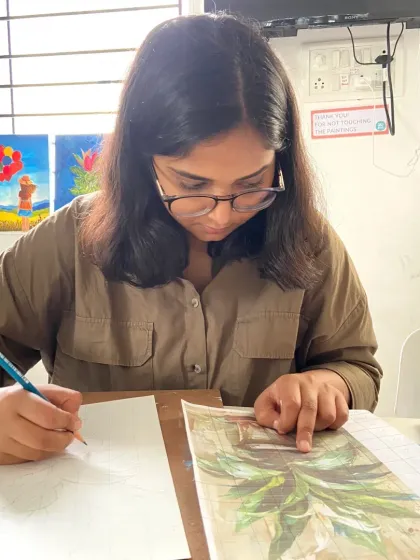 This student is carefully sketching her composition before starting to paint, an important first step we teach in our courses.