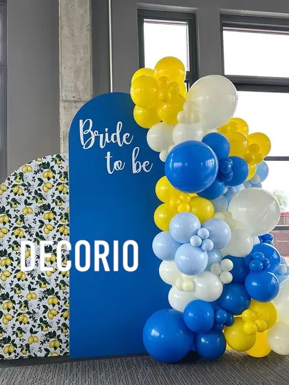 If you want a theme that's unique and vibrant, I can create custom color combinations like this one. The lemon-print backdrop paired with a bold blue panel and a yellow and blue balloon garland makes for a fresh and cheerful bachelorette party theme.