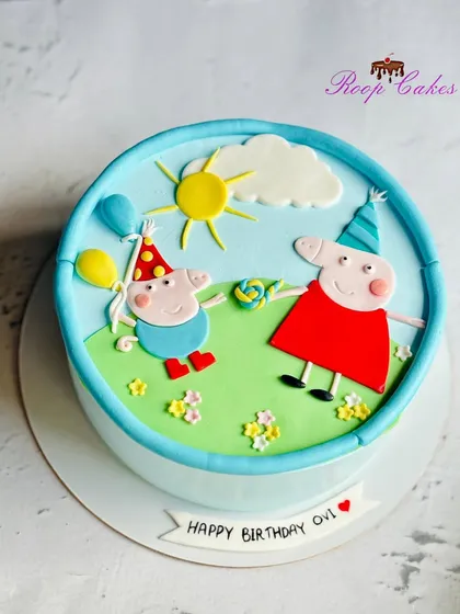 A cheerful Peppa Pig-themed birthday cake to celebrate a special day, featuring Peppa and George enjoying a sunny day.