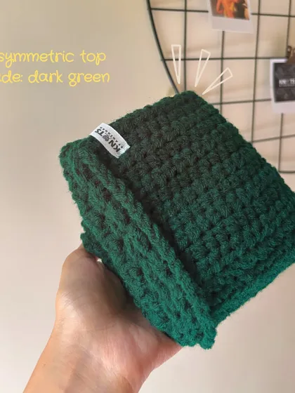Here's a folded view of a custom asymmetric top I made in a rich dark green. You can see the tight, neat stitches that make the piece so durable.