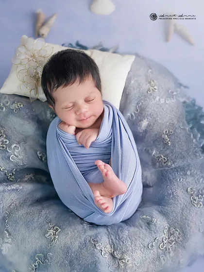 A sleepy smile from our tiny sailor. Capturing these fleeting expressions is what makes each newborn session so special and unique.