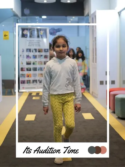 Walking with focus and a smile, this participant is enjoying her audition. We aim to make the experience positive for everyone.