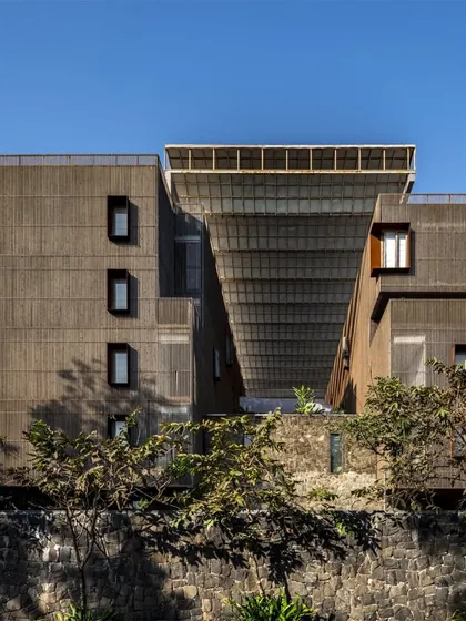 The Radisson Resort in Lonavala emerges from the site's topography and material history. Using local black basalt and wood, the architecture adapts to the program while grappling with the contradictions of rapid urbanization, seeking to restore a connection to nature.