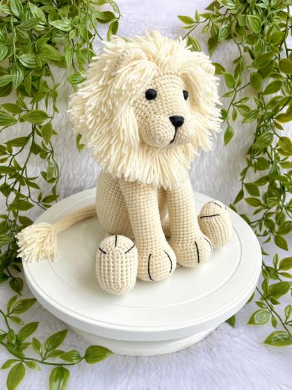 This majestic white lion has such a beautiful, full mane. I love making this sitting version, which is perfect for display in a nursery or for gentle play. The details on his paws make him extra special.