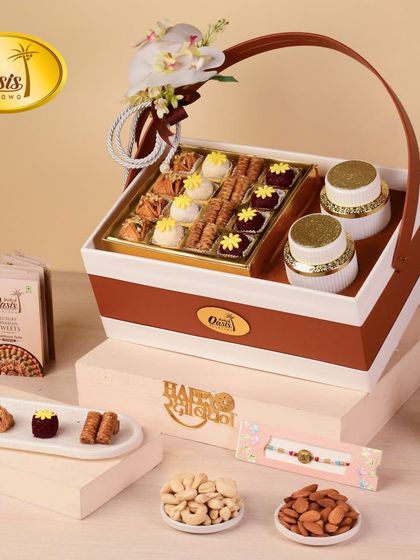 A beautiful gift hamper designed for special occasions, featuring a mix of our classic baklava, fusion balls, and two decorative jars, complete with a Rakhi tag.
