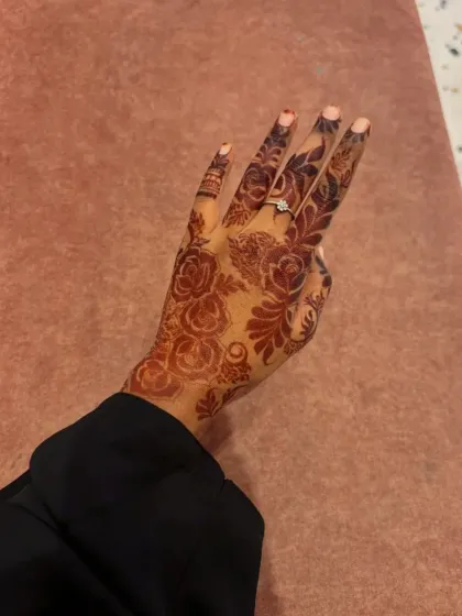 This beautiful floral design on the back of the hand shows the rich, mature stain from my standard henna cones. It's a great example of a party or festive design that is both elegant and bold.