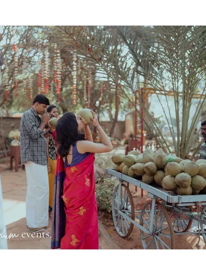 To keep guests refreshed during the summer backyard wedding, we set up a cart with fresh tender coconuts, a simple and thoughtful detail.