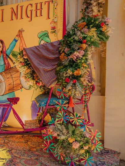 A quirky and colourful photo prop for the Punjabi night. This decorated cycle is draped in Phulkari fabric and adorned with fresh flowers and pinwheels, making for a fun and memorable picture spot.