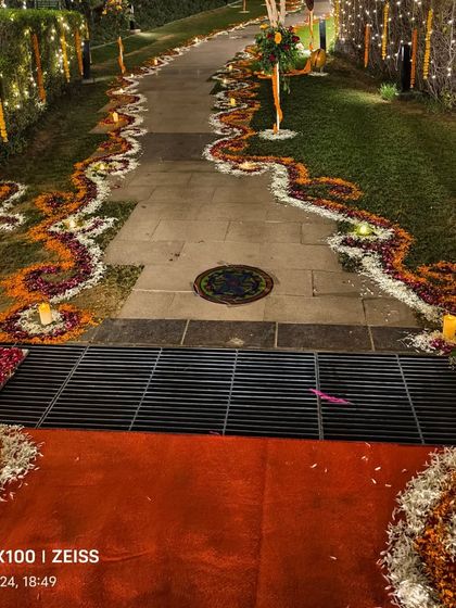 A close-up of the beautiful floral pathway created with marigold and rose petals for the Diwali party.