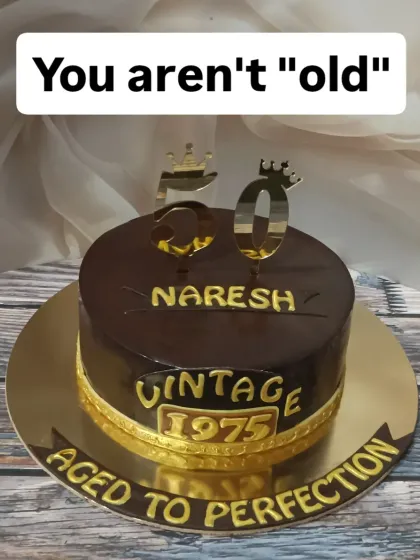 Another take on the "Aged to Perfection" theme. This rich chocolate cake with gold lettering is a stylish way to celebrate turning 50.