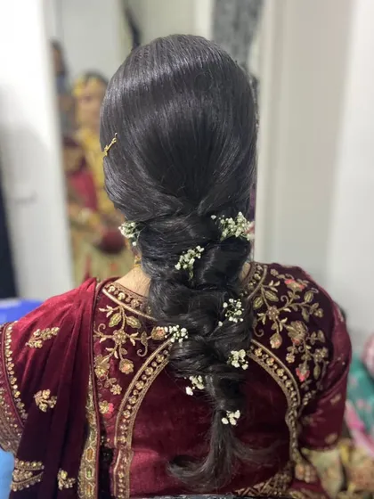A slightly different angle of the elegant bridal braid, showing the beautiful texture and placement of the flowers.