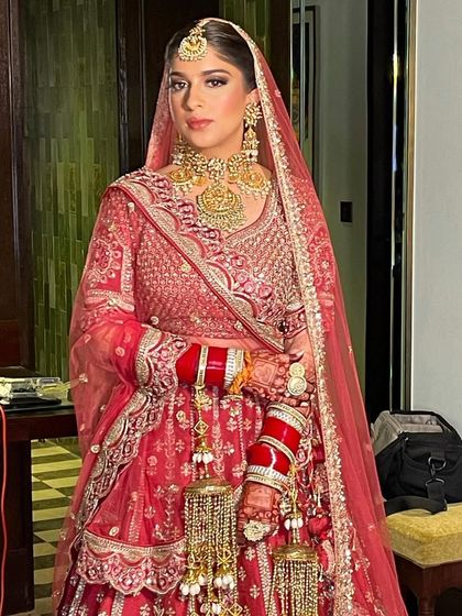 A simple and elegant braid for this beautiful morning bride. The style is perfect for an early ceremony and looks stunning with her red lehenga.