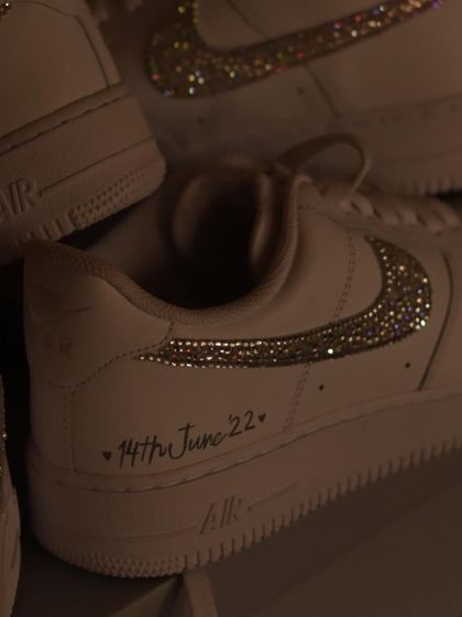 A close-up of the iced-out swoosh. Each crystal is applied by hand to create this sparkling effect. It's a great way to add a touch of glamour to a classic sneaker.