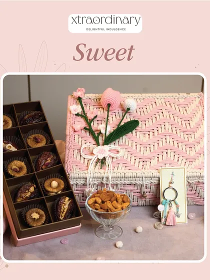 This sweet pink wicker hamper is filled with our gourmet nuts and chocolates, a lovely gift for a sister with a sweet tooth.