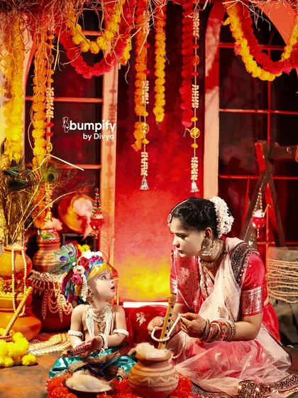 Maa ki godi mein chhota Gopal. This image of a mother as Yashoda gazing at her little Krishna is one of my favorites. It’s a timeless portrait of maternal love set against our detailed Vrindavan backdrop.