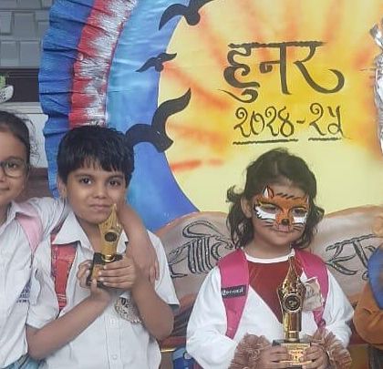 Our rising champions hold their trophies after winning first and third place at the 'Hunar 2024' inter-school competition for storytelling and a spell-a-thon.