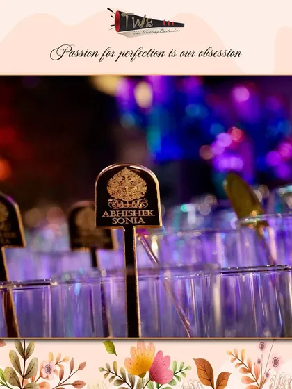 Custom stirrers with the couple's initials, "Abhishek & Sonia," adding a layer of personalization to the Sangeet night in Udaipur.