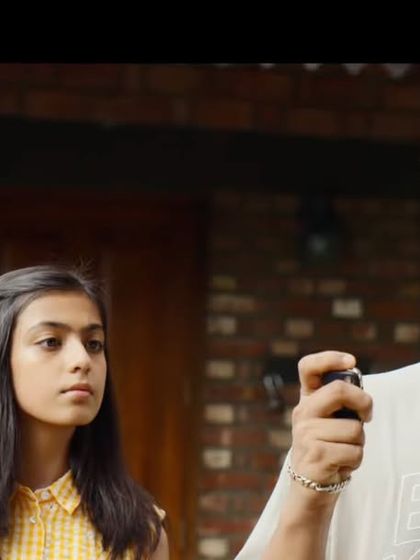 This scene shows a younger generation's story. I styled the young man in a casual graphic tee and the girl in a cute yellow checkered dress, creating a youthful and sweet vibe.