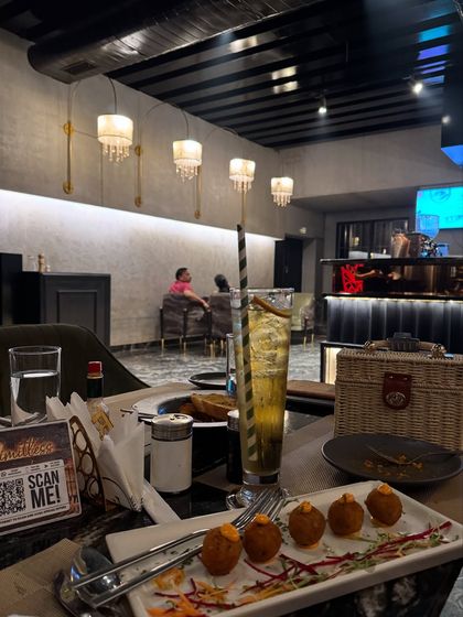 Showcasing the indoor seating and food at Limitless, giving a complete picture of what to expect.