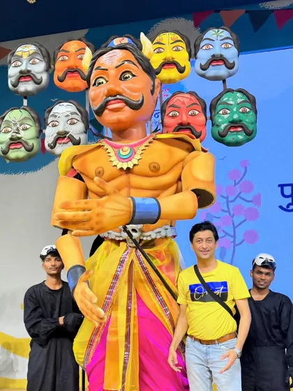 Here I am with my team and the ten-headed Ravan puppet. Each head was individually crafted and mounted to represent a different challenge faced by farmers, making it a complex and meaningful design.