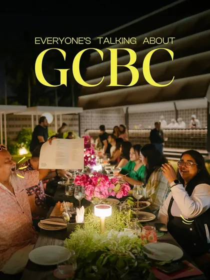 Everyone's talking about the events at GCBC. This photo captures the vibrant atmosphere of a large dinner party on our lawn, complete with beautiful floral arrangements and ambient lighting.